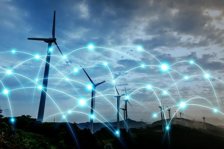 smart grid image above wind turbines at night